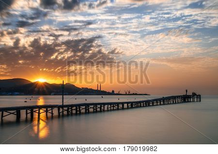 Majorca Puerto de Alcudia beach pier at sunrise in Alcudia bay in Mallorca Balearic islands of Spain