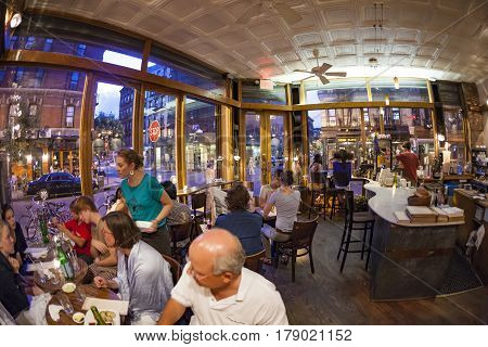NEW YORK USA- JUL 9 2010: Tourists and local people enjoy the restaurant at the Orchard street in New York. The area was First known as Little Germany later a Jewish enclave.