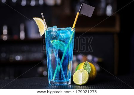Blue Lagoon cocktail with a slice of lime and lemon