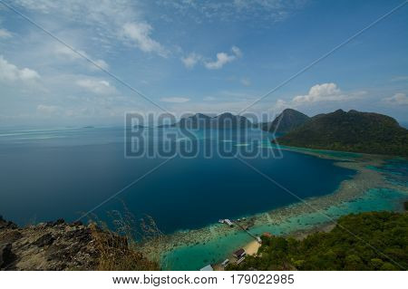 Beautiful tropical Bohey Dulang island with beach and blue water for relax