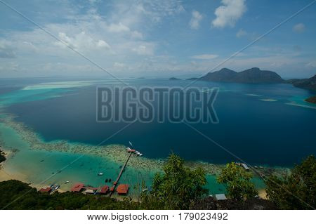 Beautiful tropical Bohey Dulang island with beach and blue water for relax