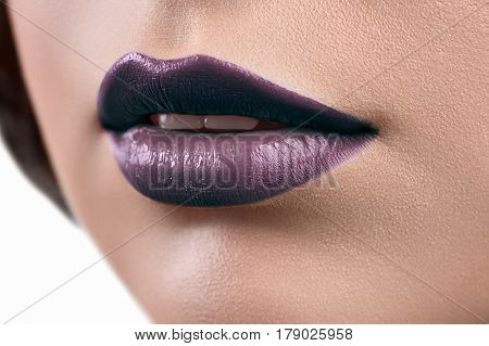 Dark lipstick. Cropped macro shot of professional makeup sexy lips with dark purple lipstick on cosmetic lip gloss beauty salon fashion creative artistic sensuality sexuality femininity concept