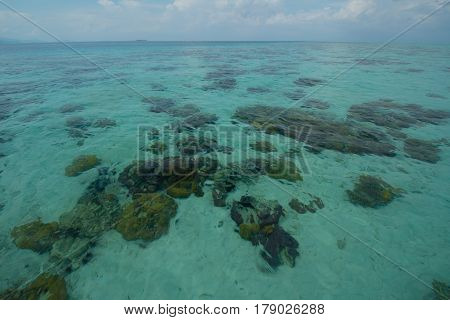 Beautiful tropical Bohey Dulang island with beach and blue water for relax