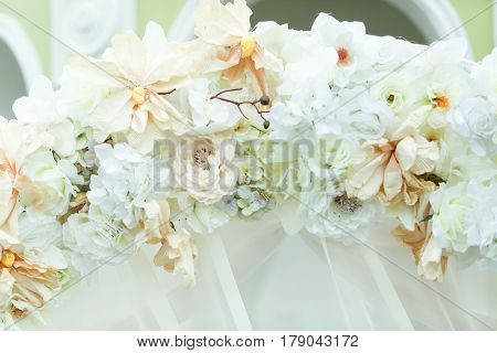 Wedding altar decorated with white and beig flowers