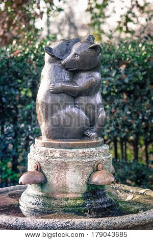 Drinking fountain with a statue of two embracing bears in Kensington Gardens London