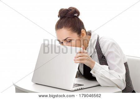 Woman hiding what she doing on laptop. Business found some secret information on pc