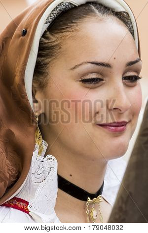 CAGLIARI, ITALY - May 1, 2014: 358 Religious Procession of Sant'Efisio - portrait of a beautiful girl in traditional Sardinian costume - Sardinia