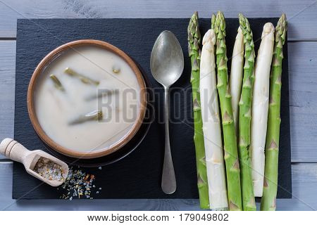 Spring season - white and green asparagus cream-soup ready to eat