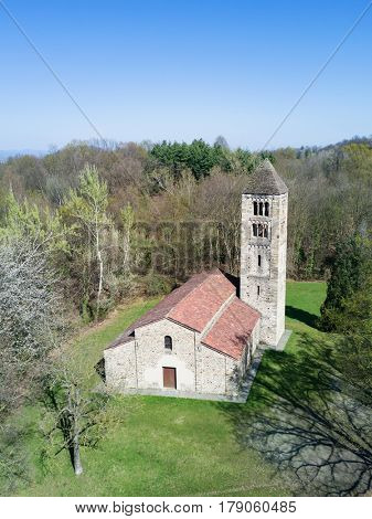 Aerial view of a old italian rural church. San Secondo is an antique small church (11th century), example of the Romanesque architecture in north Italy. Magnano, Piemonte, Italy.  