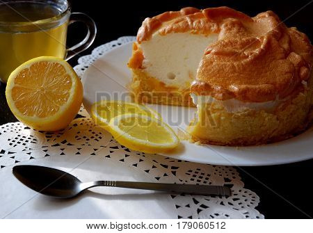 Lemon cake and lemons. Beautiful background with lemon cake and tea selenim.