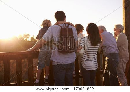 Multi Generation Family Standing On Outdoor Observation Deck