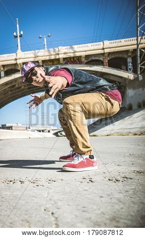 bboy doing some stunts - Street artist breakdancing outdoors