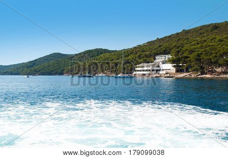 Vibrant Blue Sea With Foam Near The Coast