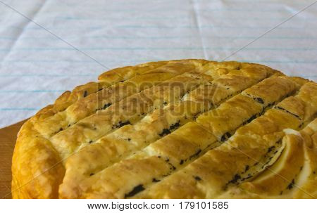 head of traditional Adygei cheese handmade on wooden Board