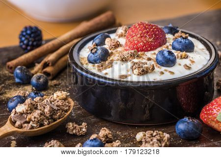 Fresh White Yogurt with Strawberry Blueberries and Muesli