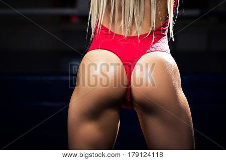 Sexy beautiful sporty ass . Beautiful athletic woman. Red bodysuit
