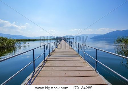 The pedestrian ponton bridge used to connect the Agios Achillios island in the Small Prespa Lake in Macedonia Greece Europe.