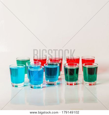 Glasses With Blue, Green And Red Kamikaze, Glamorous Drinks, Mixed Drink Poured Into Shot Glasses