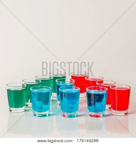 Glasses With Blue, Green And Red Kamikaze, Glamorous Drinks, Mixed Drink Poured Into Shot Glasses