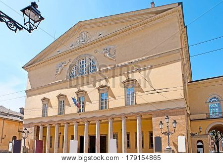 The facade of Parma Opera House named Teatro Regio or New Ducal Theater faces the Garibaldi Street Italy.