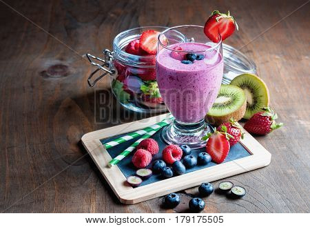 Berry smoothie with yogourt summer detox drink clean eating vegetarian vegan superfood and healthy diet concept selective focus toned image