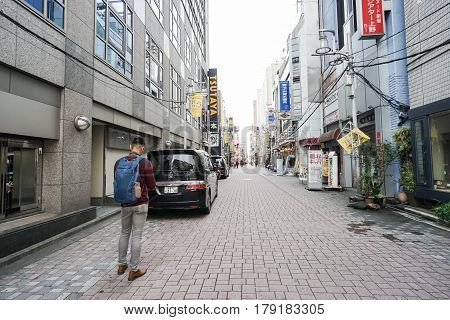 man walk on concrete pavement taken in Shibuya Tokyo on 5 Decmber 2016