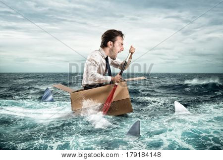 Fearful Businessman escapes screaming from sharks on a cardboard. Funny face