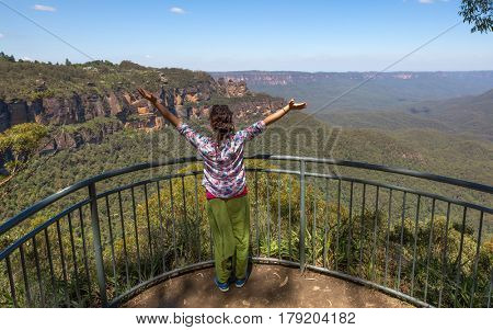 Woman enjoying her freedom with open arms, Australia
