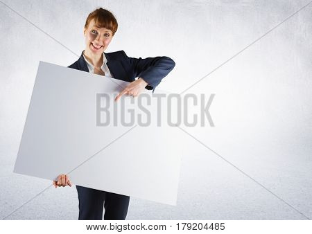 Digital composite of Business woman with large card against white background