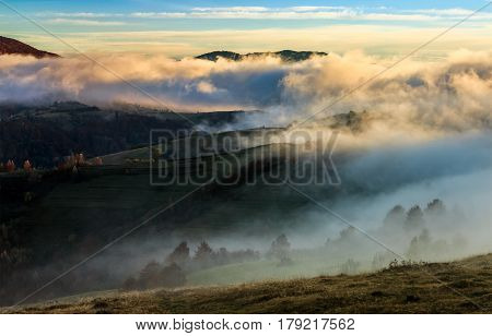 Mountain Rural Area In Foggy Autumn Morning