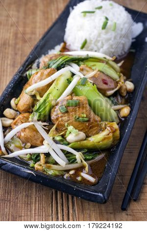 Traditional Chicken Gung Bao with Vegetable as close-up on a plate