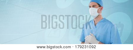 Surgeon wearing medical gloves and mask against medical icons