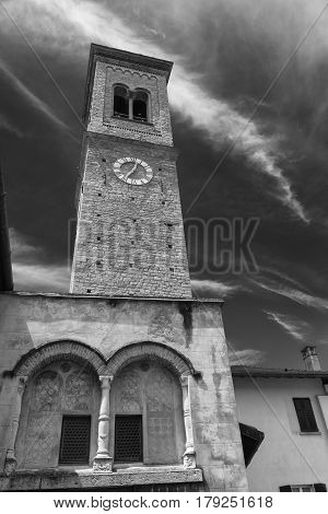 Torno (Como Lombardy Italy) old typical village along the Lario lake.. Church with its belfry. Black and white