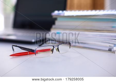 Group Of Multicolored Office Folders And Glasses