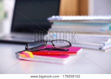 Group Of Multicolored Office Folders And Glasses