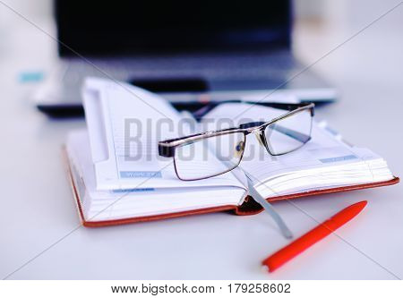 Group Of Multicolored Office Folders And Glasses