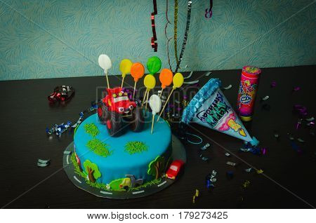 Children's birthday cake decorated tasty car and ballons