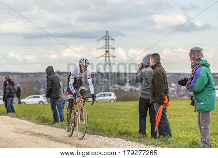 VendomeFrance- March 72016:The Luxembourgish cyclist Frank Schleck of Trek-Segafredo Team riding on a dirty roadTertre de la Motte in Vendome during the first stage of Paris-Nice 2016.
