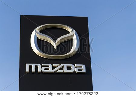 Prague, Czech Republic - March 31: Mazda Car Company Logo In Front Of Dealership Building On March 3