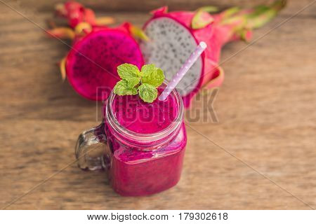 Smoothies Of A Red Organic Dragon Fruit On An Old Wooden Background