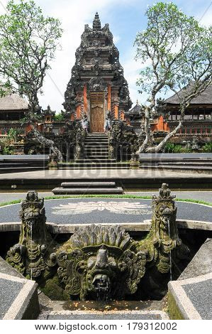 Ubud, indonesia - 10 February 2013: Lotus pond and Pura Saraswati temple in Ubud Bali Indonesia.