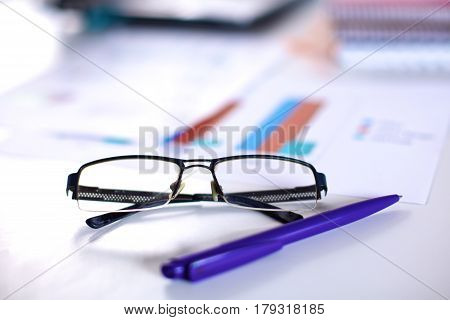 Group of multicolored office folders and glasses.