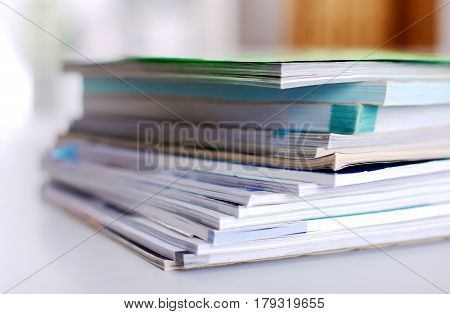 Group of multicolored office folders and glasses.