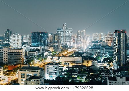 Illuminated night Bangkok city. Close - up.