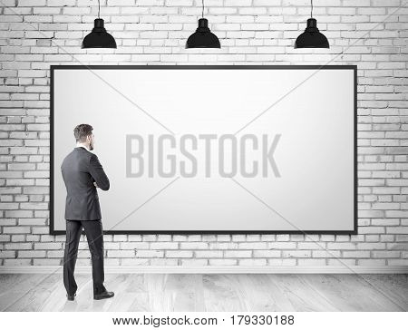 Man In Suit And Blank Whiteboard