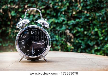 Alarm Clock On Wooden Background, stock photo