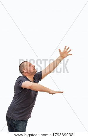The man creates an image of the request and entreaty by gestures and a mimicry on the isolated background.
