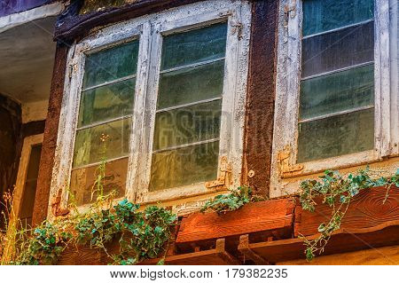 Rustic weathered old window at an old building.