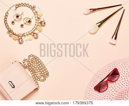 Fashion lady accessories set. Falt Lay. Stylish handbag. Make-Up brushes. Jewelry. Summer sunglasses and hat. Women accessories