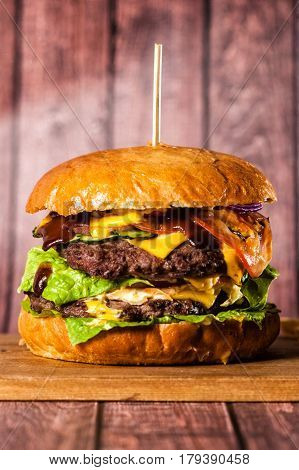 Double Burger On The Board On Wooden Background